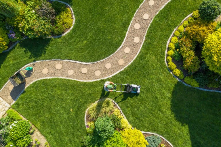 Aerial view of someone mowing a residential lawn